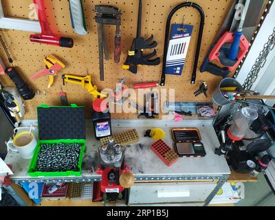 A closeup of the pistol ammunition reloading process Stock Photo