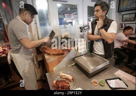 (180629) -- VANCOUVER, June 29, 2018 -- Anson Leung prepares dishes for costumers at the HK BBQ Master restaurant in the Vancouver suburb of Richmond, Canada, June 28, 2018. TO GO WITH Feature: Young barbecue master carries on Chinese family business in Vancouver ) (zjl) CANADA-VANCOUVER-CHINESE BARBECUE-RESTAURANT LiangxSen PUBLICATIONxNOTxINxCHN Stock Photo