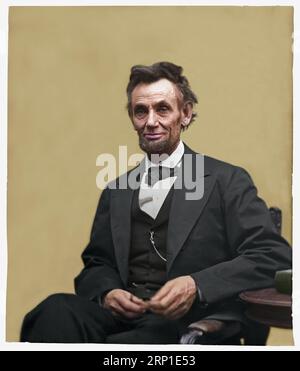 Abraham Lincoln, three-quarter length portrait, seated and holding his spectacles and a pencil. The photograph was created by Alexander Gardner on 5th Stock Photo