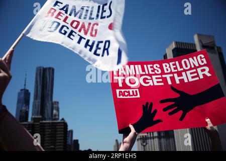 (180630) -- NEW YORK, June 30, 2018 -- Protesters hold posters during the Families Belong Together rally in New York, the United States, on June 30, 2018. Tens of thousands of Americans marched and rallied across the United States to protest the Trump administration s zero tolerance immigration policy resulting in over 2,000 children separated from their families who crossed the border illegally. ) U.S.-NEW YORK-IMMIGRATION POLICY-PROTEST LixMuzi PUBLICATIONxNOTxINxCHN Stock Photo
