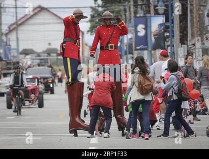 (180701) -- RICHMOND, July 1, 2018 -- Performers interact with the crowds during the 73rd Salmon Festival Parade in Richmond, Canada, July 1, 2018. Thousands of people participated in the 73rd Salmon Festival Parade in Richmond on Sunday to celebrate the Canada Day. ) CANADA-RICHMOND-SALMON FESTIVAL PARADE-CANADA DAY LiangxSen PUBLICATIONxNOTxINxCHN Stock Photo