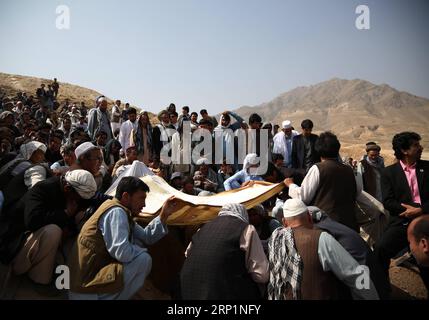(180716) -- KABUL, July 16, 2018 -- Friends and relatives take part in funeral of a suicide attack victim in Kabul, capital of Afghanistan, July 16, 2018. Up to 1,692 Afghan civilians were killed as a result of conflicts and terrorist attacks in the first half of this year, hitting a record high, a UN mission said on July 15, 2018. ) (zhf) AFGHANISTAN-KABUL-FUNERAL-CIVILIAN CASUALTY RahmatxAlizadah PUBLICATIONxNOTxINxCHN Stock Photo