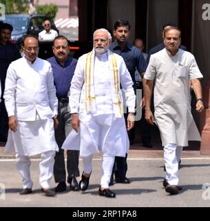 (180718) -- NEW DELHI, July 18, 2018 -- Indian Prime Minister Narendra Modi (C) arrives on the opening day of the monsoon session of parliament in New Delhi, India, July 18, 2018. The monsoon session of parliament began on Wednesday and continue until August 10. ) (rh) INDIA-NEW DELHI-MONSOON SESSION ParthaxSarkar PUBLICATIONxNOTxINxCHN Stock Photo