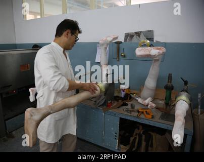 (180718) -- KABUL, July 18, 2018 -- An Afghan worker makes the prosthetic legs at the Orthopedic Center of the International Committee of the Red Cross in Kabul, capital of Afghanistan, July 18, 2018. Up to 1,692 Afghan civilians were killed as a result of conflicts and terrorist attacks in the first half of this year, hitting a record high, a UN mission said on Sunday. ) (rh) AFGHANISTAN-KABUL-ORTHOPEDIC CENTER RahmatxAlizadah PUBLICATIONxNOTxINxCHN Stock Photo