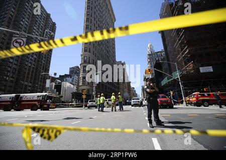 (180719) -- NEW YORK, July 19, 2018 -- Police stand guard near the spot of a steam pipe explosion in New York, the United States, July 19, 2018. A neighborhood in Manhattan, New York City, was rocked Thursday morning when a steam pipe exploded, causing transit disruptions and street closures. No injuries were reported. The cause of the blast is under investigation. )(rh) U.S.-NEW YORK-STEAM PIPE EXPLOSION WangxYing PUBLICATIONxNOTxINxCHN Stock Photo