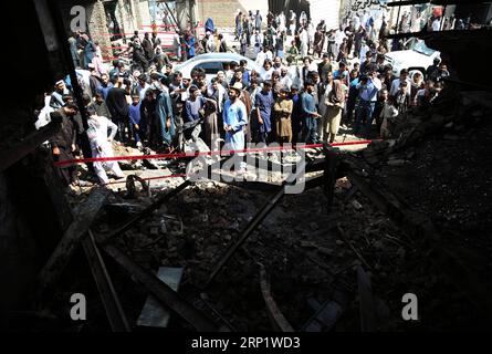 (180726) -- KABUL, July 26, 2018 -- People gather at the site of a suicide attack in Kabul, capital of Afghanistan, July 26, 2018. At least one Afghan civilian and four intelligence officers were killed and six others injured in a Taliban suicide car bomb explosion in western side of capital city Kabul on Thursday morning, police said. )(gj) AFGHANISTAN-KABUL-SUICIDE ATTACK RahmatxAlizadah PUBLICATIONxNOTxINxCHN Stock Photo