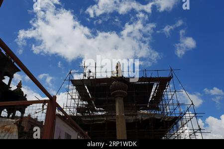 (180726) -- LALITPUR, July 26, 2018 -- People work at a reconstruction site of Patan Durbar Square in Lalitpur, Nepal, on July 25, 2018. Reconstruction process is undergoing in Patan Durbar Square as many temples were badly damaged in the earthquake in 2015. ) (jmmn) NEPAL-LALITPUR-RECONSTRUCTION sunilxsharma PUBLICATIONxNOTxINxCHN Stock Photo