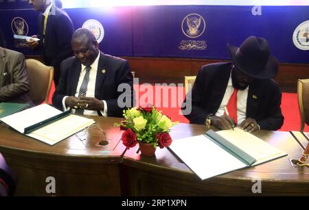 (180805) -- KHARTOUM, Aug. 5, 2018 -- South Sudanese President Salva Kiir (R) and major opposition leader Riek Machar (L front) sign on the final deal on power-sharing and security arrangements between South Sudan s conflicting parties, in Khartoum, capital of Sudan, Aug. 5, 2018. South Sudan s conflicting parties on Sunday signed a final deal in the Sudanese capital Khartoum on power-sharing and security arrangements. ) SUDAN-KHARTOUM-SOUTH SUDAN-FINAL DEAL-POWER-SHARING MohamedxKhidir PUBLICATIONxNOTxINxCHN Stock Photo