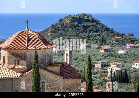 Looking down on the Acropolis of Ancient Lefktro at Stoupa with the church of Ypapanti at Lefktro in the foreground, Stoupa, Western Mani, Peloponnese Stock Photo