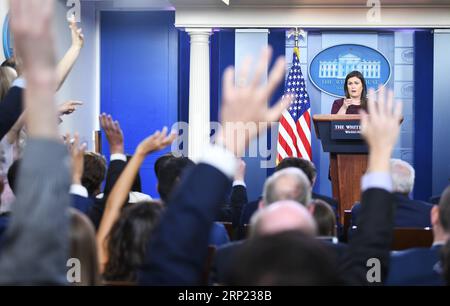 (180814) -- WASHINGTON, Aug. 14, 2018 -- White House spokesperson Sarah Sanders (Rear) attends a press briefing at the White House in Washington D.C., the United States, Aug. 14, 2018. The White House said Tuesday that U.S. National Security Advisor John Bolton will meet his Russian counterpart in Geneva of Switzerland next week as a follow-up to the Helsinki summit last month between U.S. President Donald Trump and Russian President Vladimir Putin. ) U.S.-WASHINGTON D.C.-WHITE HOUSE-PRESS BRIEFING LiuxJie PUBLICATIONxNOTxINxCHN Stock Photo