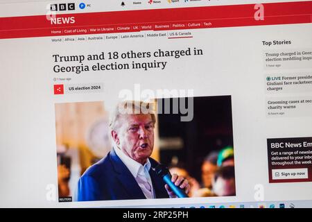 'Trump and 18 others charged in Georgia election inquiry' headline on BBC News  website with breaking news, 15th August 2023. Stock Photo