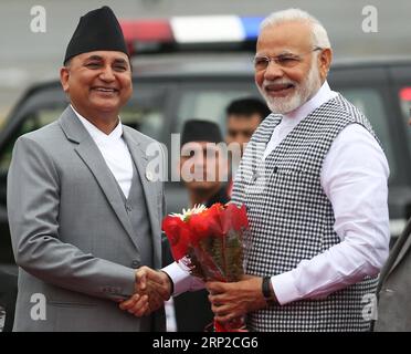 (180830) -- KATHMANDU, Aug. 30, 2018 -- Nepal s Deputy Prime Minister Ishwar Pokharel (L) welcomes Indian Prime Minister Narendra Modi after his arrival to attend the Bay of Bengal Initiative for Multi-Sectoral Technical and Economic Cooperation (BIMSTEC) summit at Tribhuvan International Airport in Kathmandu, Nepal Aug. 30, 2018. Nepal is all set to host the fourth summit of the BIMSTEC on Thursday and Friday, amid tight security. ) (gj) NEPAL-KATHMANDU-BIMSTEC SUMMIT sunilxsharma PUBLICATIONxNOTxINxCHN Stock Photo