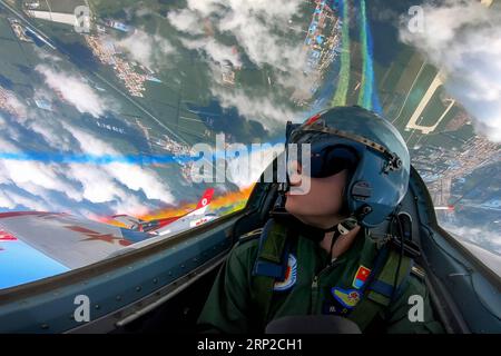 (180830) -- CHANGCHUN, Aug. 30, 2018 -- A pilot of Red Falcon Air Demonstration Team performs during an activity of opening day at the Aviation University of Air Forces in Changchun, capital of northeast China s Jilin Province, Aug. 30, 2018. ) (mp) CHINA-CHANGCHUN-AIR FORCE-PERFORMANCE (CN) YangxPan PUBLICATIONxNOTxINxCHN Stock Photo