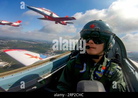 (180830) -- CHANGCHUN, Aug. 30, 2018 -- A pilot of Red Falcon Air Demonstration Team performs during an activity of opening day at the Aviation University of Air Forces in Changchun, capital of northeast China s Jilin Province, Aug. 30, 2018. ) (mp) CHINA-CHANGCHUN-AIR FORCE-PERFORMANCE (CN) YangxPan PUBLICATIONxNOTxINxCHN Stock Photo