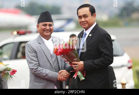 (180830) -- KATHMANDU, Aug. 30, 2018 -- Nepal s Deputy Prime Minister Ishwar Pokharel (L) welcomes Thailand s Prime Minister Prayut Chan-o-cha after his arrival to attend the Bay of Bengal Initiative for Multi-Sectoral Technical and Economic Cooperation (BIMSTEC) summit at Tribhuvan International Airport in Kathmandu, Nepal Aug. 30, 2018. Nepal is all set to host the fourth summit of the BIMSTEC on Thursday and Friday, amid tight security. ) (gj) NEPAL-KATHMANDU-BIMSTEC SUMMIT sunilxsharma PUBLICATIONxNOTxINxCHN Stock Photo