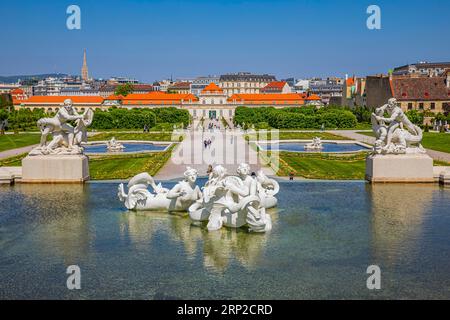 Fountain with figures from Greek mythology, lower Belvedere Palace in the background, Vienna, Austria Stock Photo