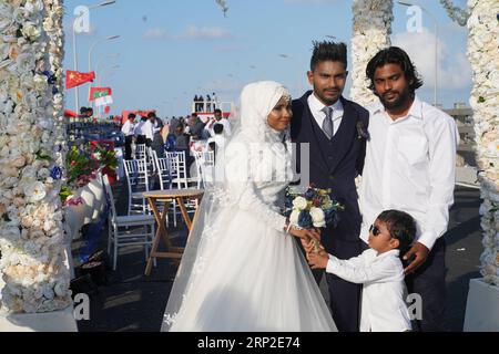 180901) -- MALE, Sept. 1, 2018 -- A Maldivian couple attend a mass