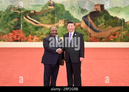 (180903) -- BEIJING, Sept. 3, 2018 -- Chinese President Xi Jinping (R) welcomes Gabonese President Ali Bongo Ondimba, who is here to attend the 2018 Beijing Summit of the Forum on China-Africa Cooperation (FOCAC), at the Great Hall of the People in Beijing, capital of China, Sept. 3, 2018. )(mcg) CHINA-BEIJING-FOCAC-XI JINPING-WELCOME (CN) YanxYan PUBLICATIONxNOTxINxCHN Stock Photo