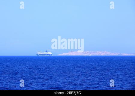 May 27 2023 - Santa Teresa Gallura, Sardinia in Italy, Mediterranean sea: Large Grimaldi Lines RoRo (Roll on/off) vessel cruising the Mediterranean se Stock Photo