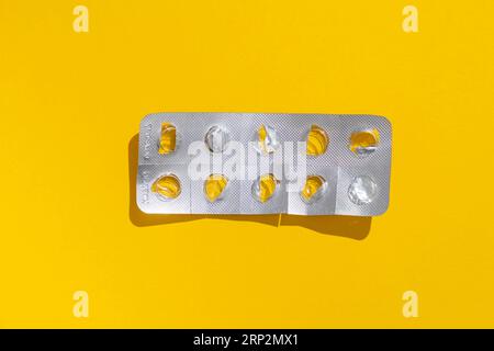 Empty tablet blister pack against a monochrome background, top view Stock Photo