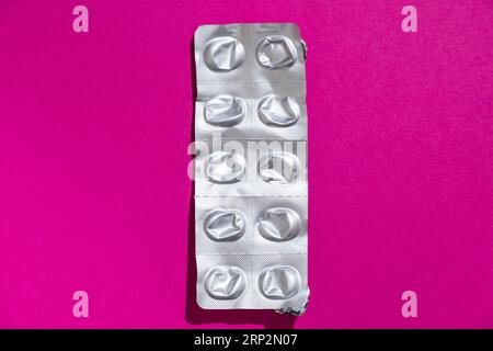 Empty tablet blister pack against a monochrome background, top view Stock Photo