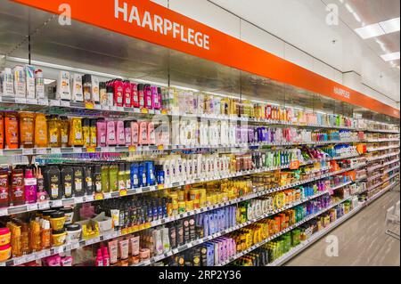 Shelves with hair care products in a department store, Allgaeu, Bavaria, Germany Stock Photo