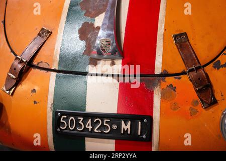 Front view of orange Porsche 356 C 1600 racing car from 1964 with Italian number plate, Italian flag livery and leather hood or bonnet straps Stock Photo