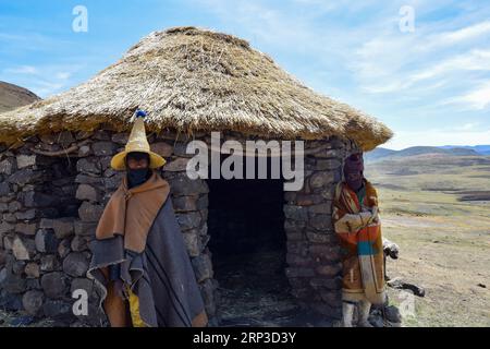 Sotho shepherds in front of their hut Stock Photo