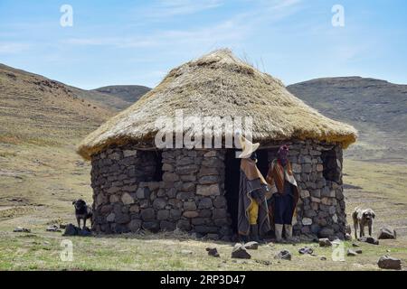 Sotho shepherds in front of their hut Stock Photo