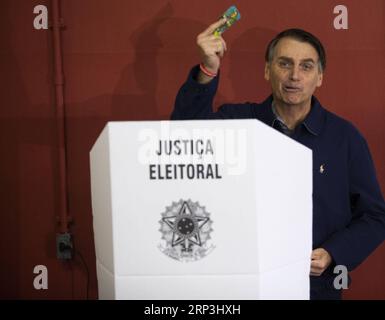 (181007) -- RIO DE JANEIRO, Oct. 7, 2018 -- Brazilian presidential candidate of the Social Liberal Party Jair Bolsonaro casts his vote during the general elections, in Marechal Hermes, in the north of Rio de Janeiro, Brazil, on Oct. 7, 2018. Brazilians began to cast votes in the general elections on Sunday expected to produce a new president and state and federal legislators. Wilton Junior/) (da) (cr) (xr) ***BRAZIL OUT*** BRAZIL-RIO DE JANEIRO-ELECTIONS AGENCIAxESTADO PUBLICATIONxNOTxINxCHN Stock Photo