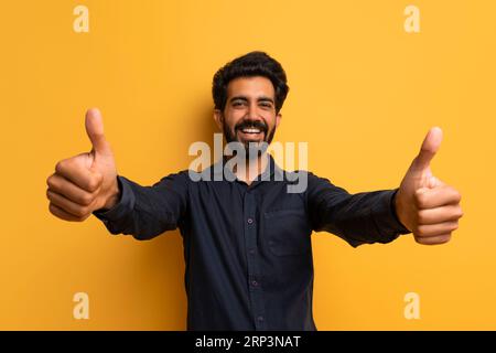 Cheerful Happy Indian Man Showing Thumbs Up At Camera Stock Photo