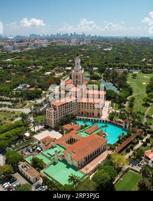 A stunning aerial view of a luxurious resort complex featuring a large swimming pool, multiple resort buildings, and lush landscaping Stock Photo