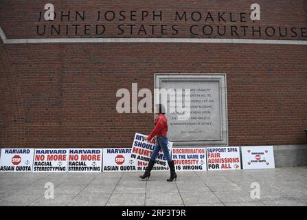 (181016) -- BOSTON, Oct. 16, 2018 -- A demonstrator sets slogans in front of John Joseph Moakley United States Courthouse in Boston, Massachusetts, the United States, on Oct. 15, 2018. A lawsuit charging Harvard University of discriminating against Asian American applicants in admissions went to trial on Monday at a U.S. District Court in Boston, drawing nationwide attention as the future of the affirmative action is also on the debate. TO GO WITH Spotlight: Trial starts over racial discrimination charges against Harvard in admissions. ) (zhf) U.S.-BOSTON-HARVARD UNIVERSITY-RACIAL DISCRIMINATI Stock Photo