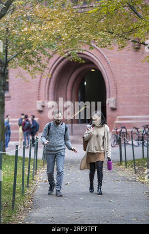 (181016) -- BOSTON, Oct. 16, 2018 (Xinhua) -- Students walk on the campus of the Harvard University in Cambridge of Massachusetts, the United States, on Oct. 15, 2018. A lawsuit charging Harvard University of discriminating against Asian American applicants in admissions went to trial on Monday at a U.S. District Court in Boston, drawing nationwide attention as the future of the affirmative action is also on the debate. (Xinhua/Wang Ying) (yy) U.S.-BOSTON-HARVARD UNIVERSTIY-DISCRIMNATION-TRAIL PUBLICATIONxNOTxINxCHN Stock Photo