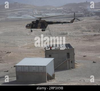 (181018) -- KABUL, Oct. 18, 2018 -- A helicopter flies over a room during a military exercise at Kabul Military Training Center (KMTC) in Kabul, capital of Afghanistan, on Oct. 17, 2018. As the date for the upcoming Afghan parliamentary elections getting closer, the Afghan Interior Ministry announced the deployment of 50,000-strong troops to ensure security for the polling process. ) (qxy) AFGHANISTAN-KABUL-MILITARY EXERCISE RahmatxAlizadah PUBLICATIONxNOTxINxCHN Stock Photo