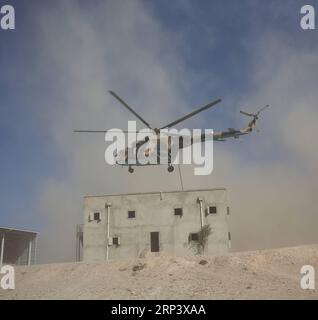 (181018) -- KABUL, Oct. 18, 2018 -- A helicopter flies over a room during a military exercise at Kabul Military Training Center (KMTC) in Kabul, capital of Afghanistan, on Oct. 17, 2018. As the date for the upcoming Afghan parliamentary elections getting closer, the Afghan Interior Ministry announced the deployment of 50,000-strong troops to ensure security for the polling process. ) (qxy) AFGHANISTAN-KABUL-MILITARY EXERCISE RahmatxAlizadah PUBLICATIONxNOTxINxCHN Stock Photo