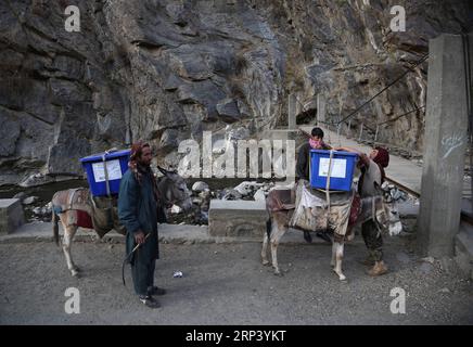 (181019) -- PANJSHIR (AFGHANISTAN), Oct. 19, 2018 -- Workers of Afghan Independent Election Commission (IEC) transport election materials in Abdullah Khil valley of Dara district of Panjshir province, eastern Afghanistan, on Oct. 19, 2018. Afghanistan will hold elections for Wolesi Jirga or the lower house of the parliament on Saturday amid serious security challenges. ) AFGHANISTAN-PANJSHIR-ELECTION MATERIALS RahmatxAlizadah PUBLICATIONxNOTxINxCHN Stock Photo