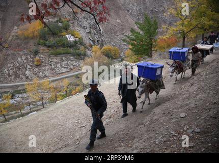 (181020) -- PANJSHIR, Oct. 20, 2018 -- Workers of Afghan Independent Election Commission (IEC) transport election materials in Abdullah Khil valley of Dara district of Panjshir province, eastern Afghanistan, on Oct. 19, 2018. Afghanistan will hold elections for Wolesi Jirga or the lower house of the parliament on Saturday amid serious security challenges. ) (djj) AFGHANISTAN-PANJSHIR-ELECTION MATERIALS RahmatxAlizadah PUBLICATIONxNOTxINxCHN Stock Photo