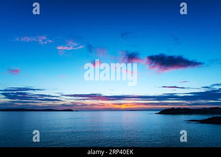 Sunset falling over Ons Island in Galicia, Spain, as seen from the air. This island was designated a Special Protection Area for bird-life in 2001 by Stock Photo
