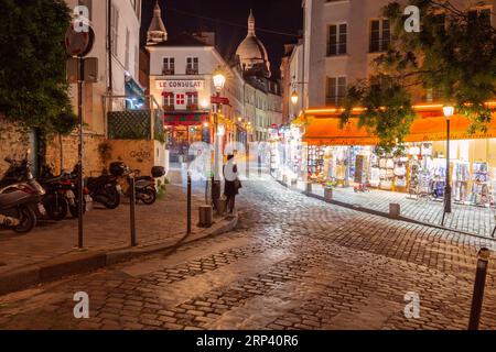 Paris, France - September 26, 2018: Old traditional street on Montmartre hill at night. Stock Photo