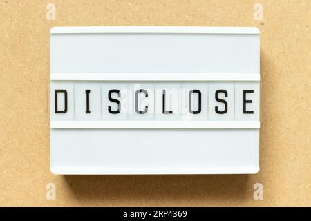 Lightbox with word disclose on wood background Stock Photo