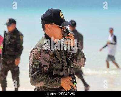 (181025) -- BORACAY ISLAND, Oct. 25, 2018 -- Policemen from the Philippine National Police (PNP) participate in a security capability demonstration along the beach in Boracay Island, the Philippines, on Oct. 25, 2018. The world famous Boracay resort island in the Philippines will be reopened on Oct. 26. )(yy) PHILIPPINES-BORACAY ISLAND-SECURITY CAPABILITY DEMONSTRATION ROUELLExUMALI PUBLICATIONxNOTxINxCHN Stock Photo