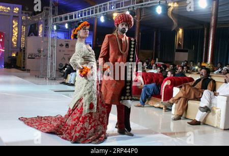 (181026) -- PESHAWAR, Oct. 26, 2018 -- Models present creations by Pakistani designer Mansoor Rajpoot during Pak-Afghan fashion show in northwest Pakistan s Peshawar on Oct. 25, 2018. ) (zxj) PAKISTAN-PESHAWAR-PAK-AFGHAN-FASHION SHOW SaeedxAhmad PUBLICATIONxNOTxINxCHN Stock Photo