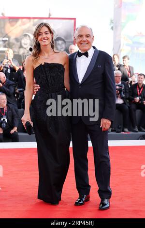 VENICE, ITALY - AUGUST 30: Giulia Rosmarini and Director of the Festival Alberto Barbera attend the opening red carpet at the 80th Venice Internationa Stock Photo