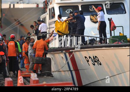 (181029) -- JAKARTA, Oct. 29, 2018 -- Search and Rescue officers move the body bags containing victims of the Lion Air JT610 that crashed into the sea off Karawang of West Java province at the joint base of Search and Rescue at the Tanjung Priok Port, Jakarta, Oct. 29, 2018. Indonesia s national Search and Rescue Agency said on Monday that all the 189 people onboard a Lion Air plane that crashed into the sea off western Indonesia may have died. ) (lrz) INDONESIA-JAKARTA-LION AIR-CRASH VerixSanovri PUBLICATIONxNOTxINxCHN Stock Photo