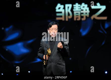 (181031) -- LOS ANGELES, Oct. 31, 2018 -- Writer Zou Jingzhi who won the Outstanding Achievement Award, receives the trophy during the awarding ceremony of the 14th Chinese American Film Festival (CAFF) in Los Angeles, the United States, Oct. 30, 2018. The 14th Chinese American Film Festival (CAFF) kicked off Tuesday at the Ricardo Montalban Theater in Hollywood in the U.S. city of Los Angeles. )(rh) U.S.-LOS ANGELES-CAFF LixYing PUBLICATIONxNOTxINxCHN Stock Photo