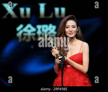 (181031) -- LOS ANGELES, Oct. 31, 2018 -- Actress Xu Lu who won the Best New Actress Award, receives the trophy during the awarding ceremony of the 14th Chinese American Film Festival (CAFF) in Los Angeles, the United States, Oct. 30, 2018. The 14th Chinese American Film Festival (CAFF) kicked off Tuesday at the Ricardo Montalban Theater in Hollywood in the U.S. city of Los Angeles. )(rh) U.S.-LOS ANGELES-CAFF LixYing PUBLICATIONxNOTxINxCHN Stock Photo