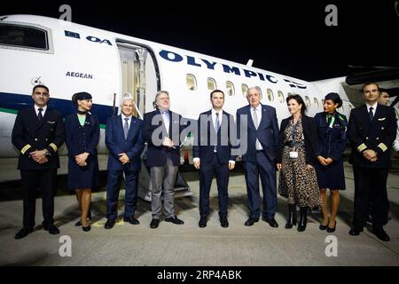 (181101) -- ATHENS, Nov. 1, 2018 -- Greek Alternate Foreign Minister George Katrougalos (4th L) and Deputy Prime Minister of the Former Yugoslav Republic of Macedonia (FYROM) Bujar Osmani (C) pose for photos with the crew of a flight to Skopje at Athens International Airport, Athens, Greece, on Nov. 1, 2018. George Katrougalos and Bujar Osmani inaugurated a new direct flight linking Athens and Skopje on Thursday. ) GREECE-ATHENS-FYROM-SKOPJE-DIRECT FLIGHT-INAUGURATION MariosxLolos PUBLICATIONxNOTxINxCHN Stock Photo