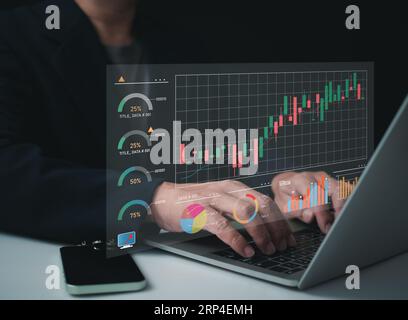 Businessman using computer for investment, investment and finance concept Businessman holding money, stock market, profit and business growth. Stock Photo