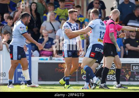 St. Helens’ Tom Makinson (centre) celebrates scoring a try with team mate Joe Batchelor during the Betfred Super League match at the Be Well Support Stadium, Wakefield. Picture date: Sunday September 3, 2023. Stock Photo